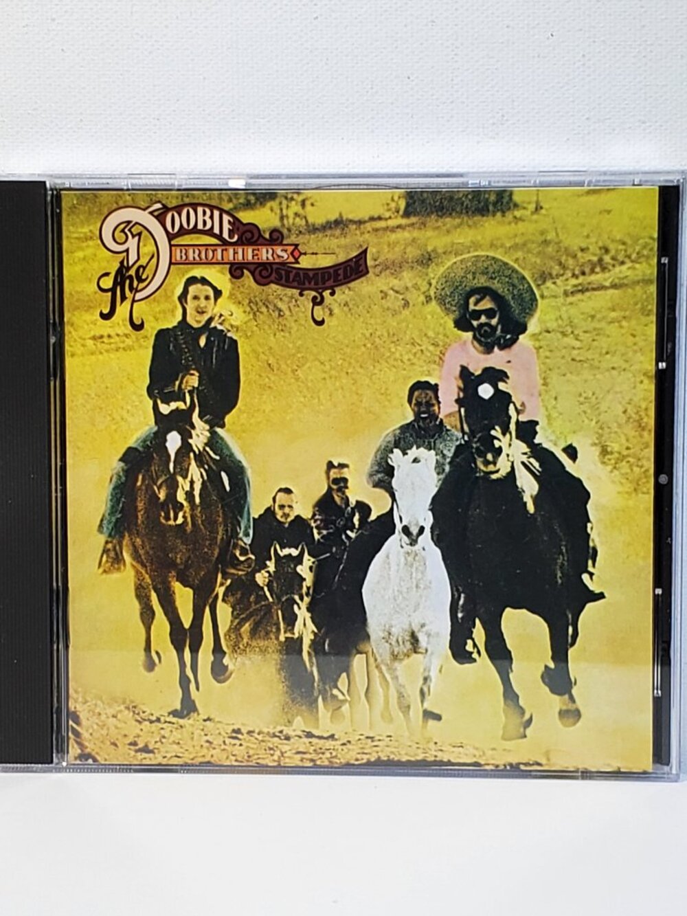 VINTAGE DOOBIE BROTHERS...STAMPEDE..COMPACT DISC...1975 WARNER BROTHERS RECORDS